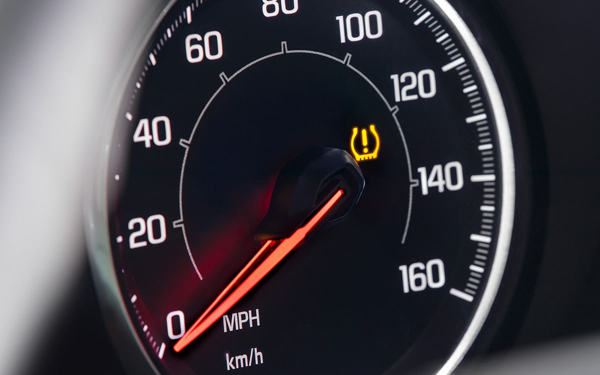 A Buick Certified Service Technician Installing a Battery