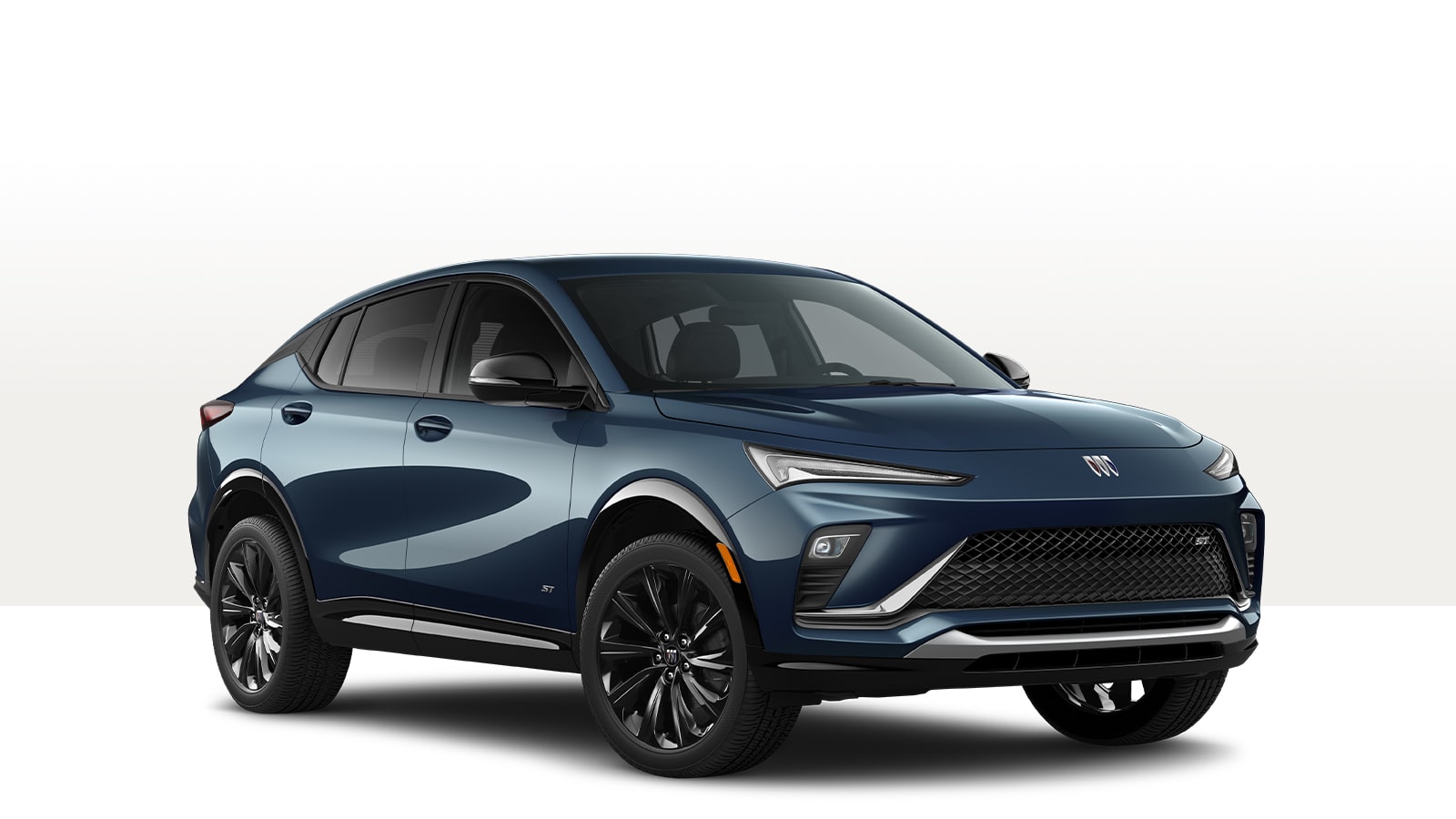 A Dark Blue Buick Envista ST Sporty SUV With Black Wheels and an ST Badge on the Side Fender