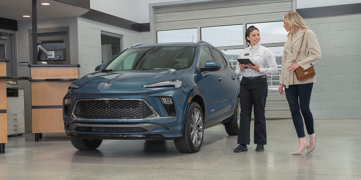 A Buick Certified Service Representative Using an iPad