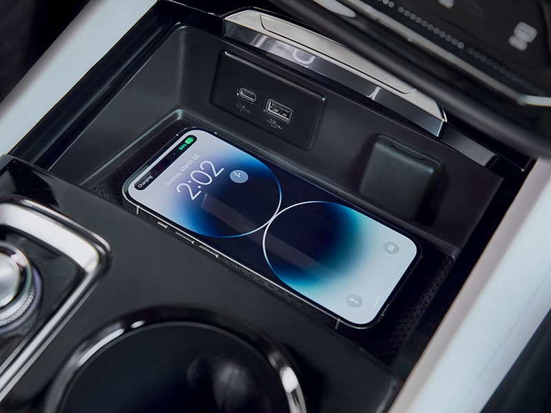 View of the Buick Center Console Where a Smartphone is Charging Using the Wireless Charging Feature