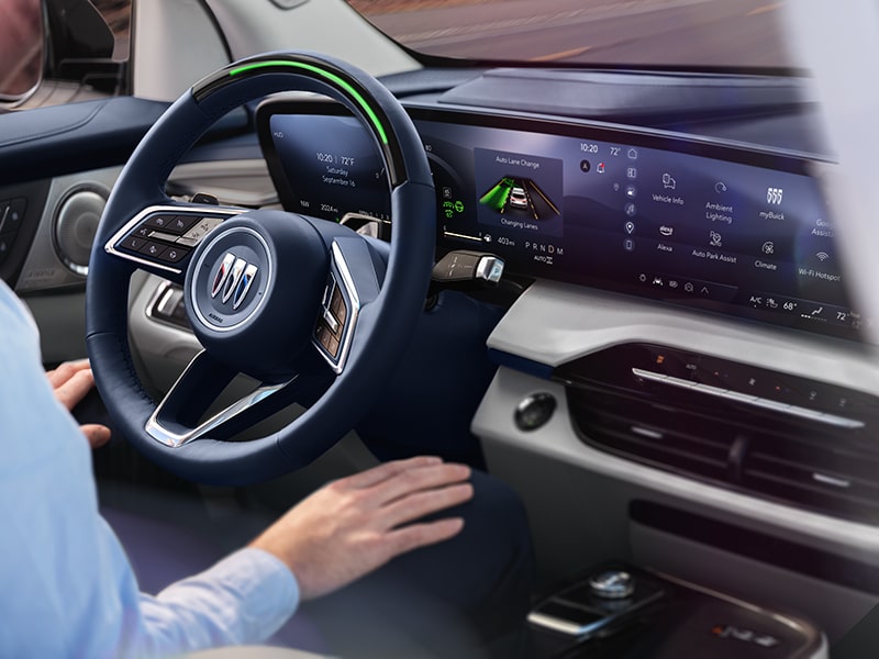 Over the Shoulder View of the Driver Using Super Cruise Hands Free Driving Technology in Their Buick Enclave