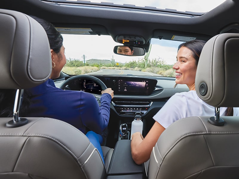 Two Women Driving and Talking in a Buick Envista