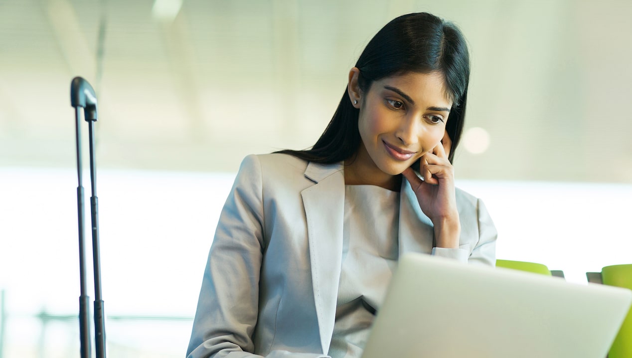 Woman checking her GM Business Card balance online