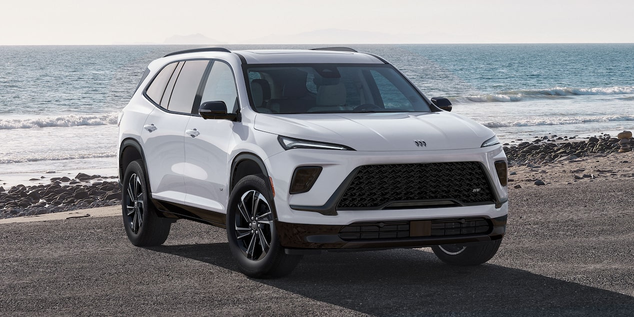 Side View of a White 2026 Buick Enclave during Evening