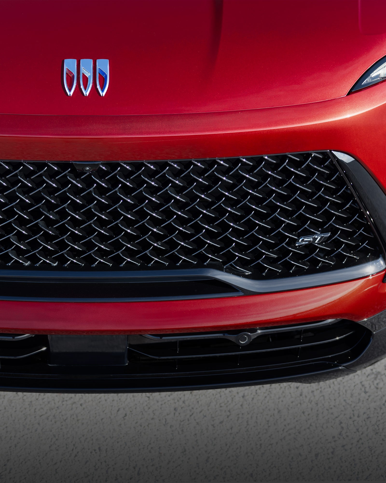 Overhead View of a the Hood and Grille of a 2026 Red Buick Enclave