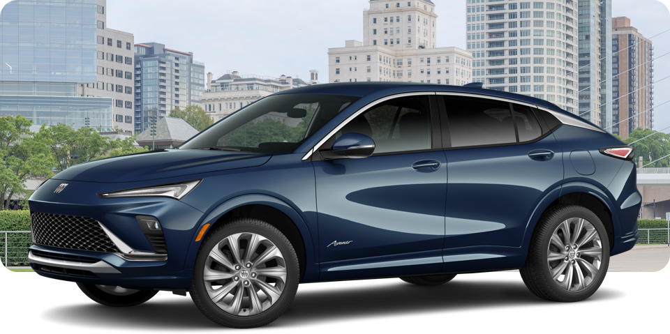 Front-Three Quarter View of a White Buick Envista Avenir Luxury SUV Parked in Front of a City