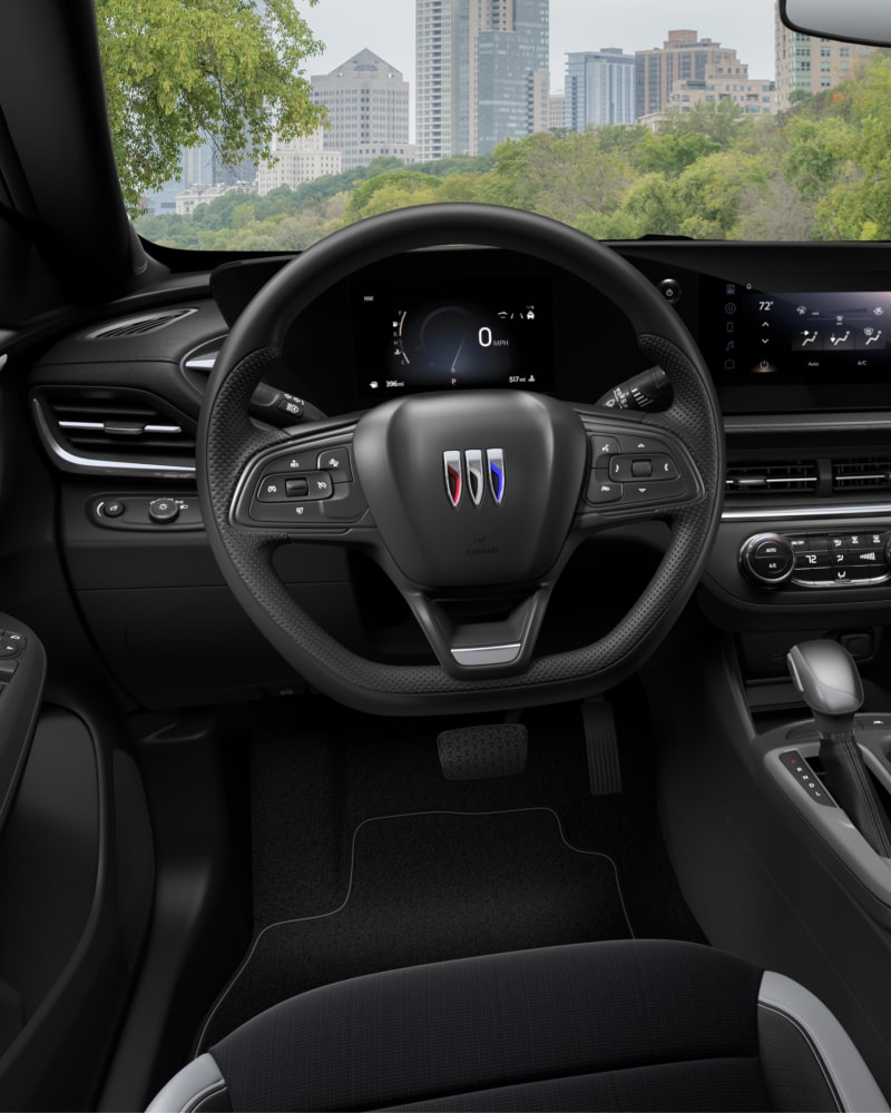 Close-up of the Buick Envista Interior Drivers Side View of the Steering Wheel and Dashboard