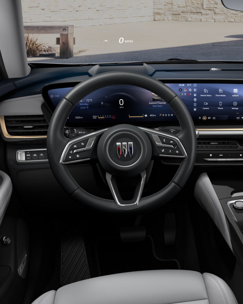 Close-up of the Buick Envision Avenir Interior Drivers Side View of the Steering Wheel and Dashboard