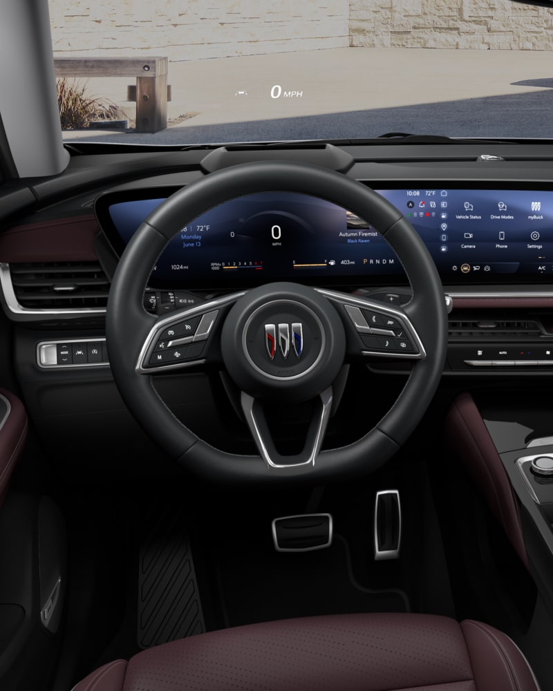 Close-up of the Buick Envision ST Interior Drivers Side View of the Steering Wheel and Dashboard